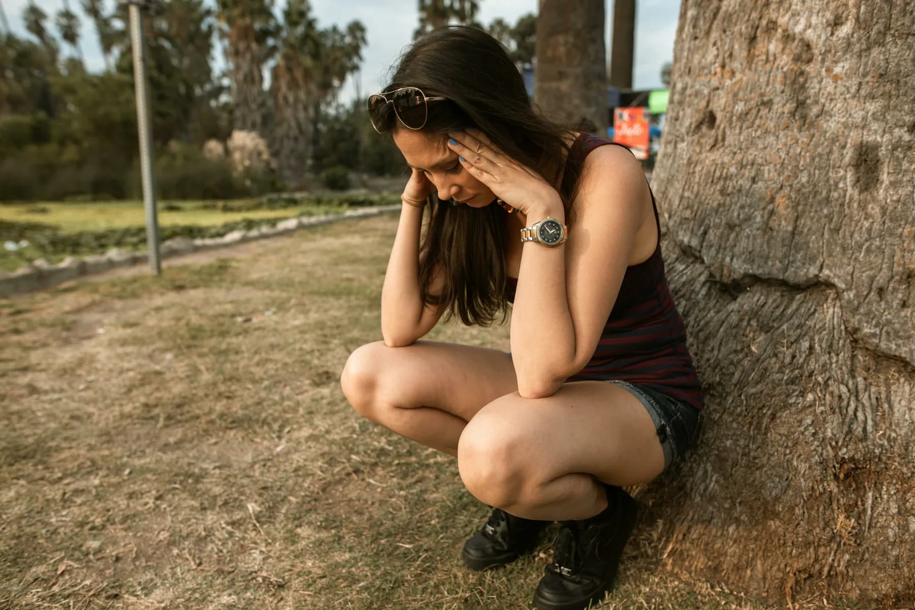 Person resting their head in their hands